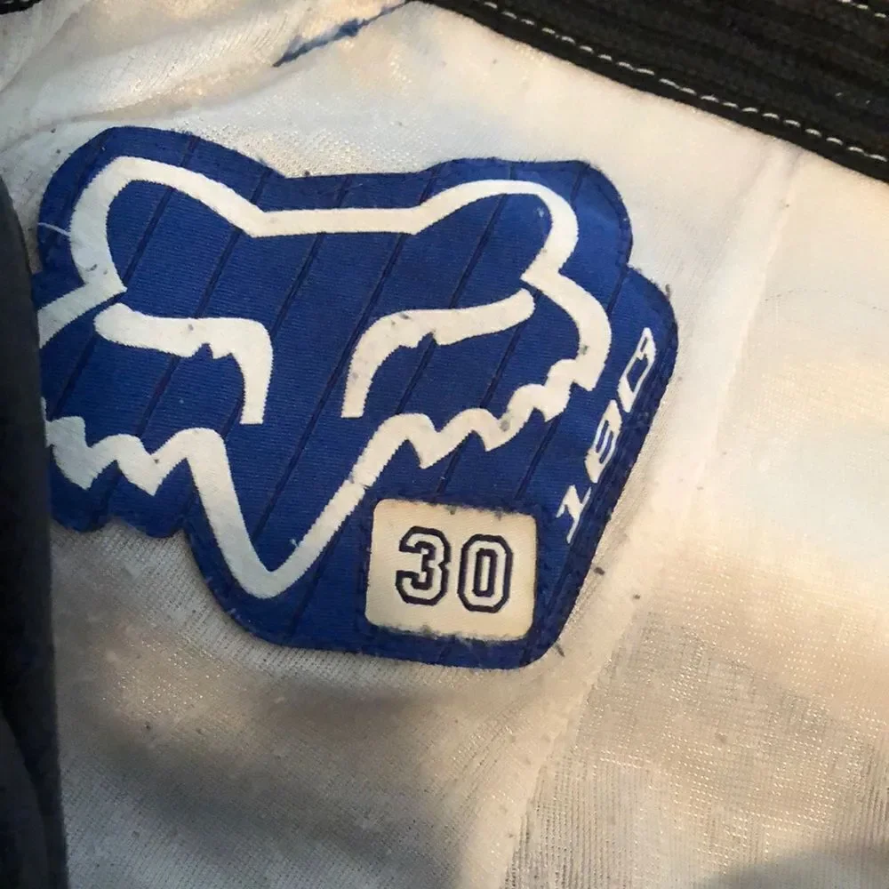 Fox Racing 180 size 30 motorcycle pants one tear